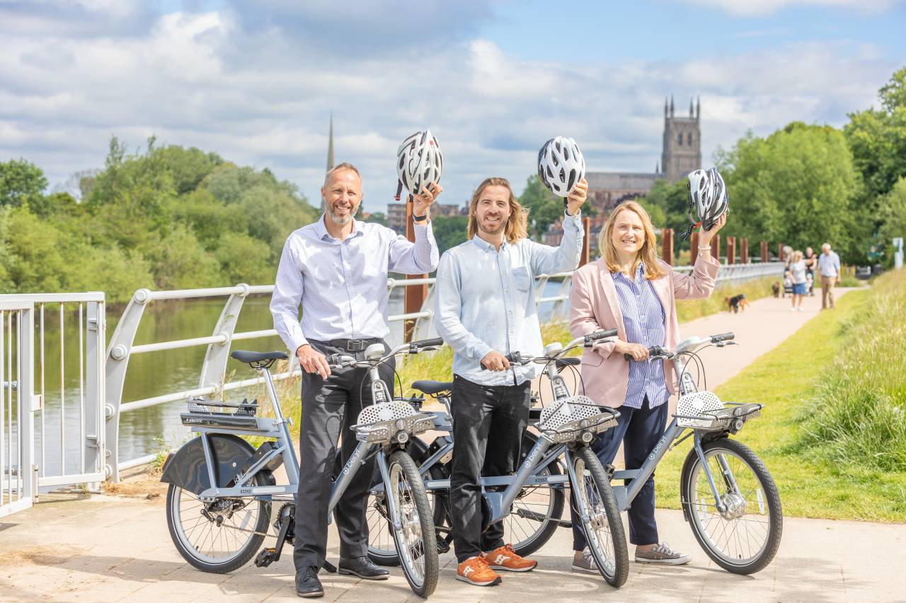Beryl Bike Launch at Diglis in Worcester. Two men and woman standing with a Beryl Bike